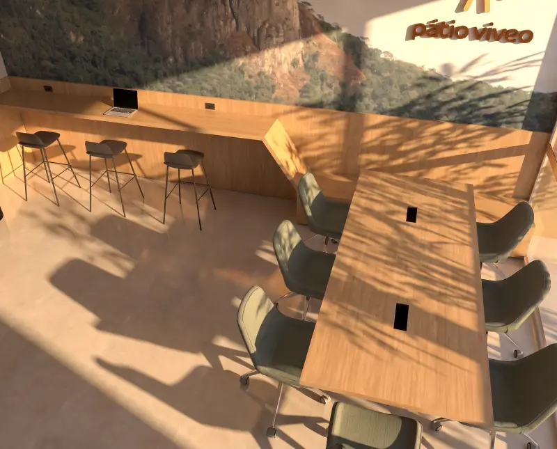 Coworking com mesa compartilhada, bancada e painel do Morro da Pedra Branca